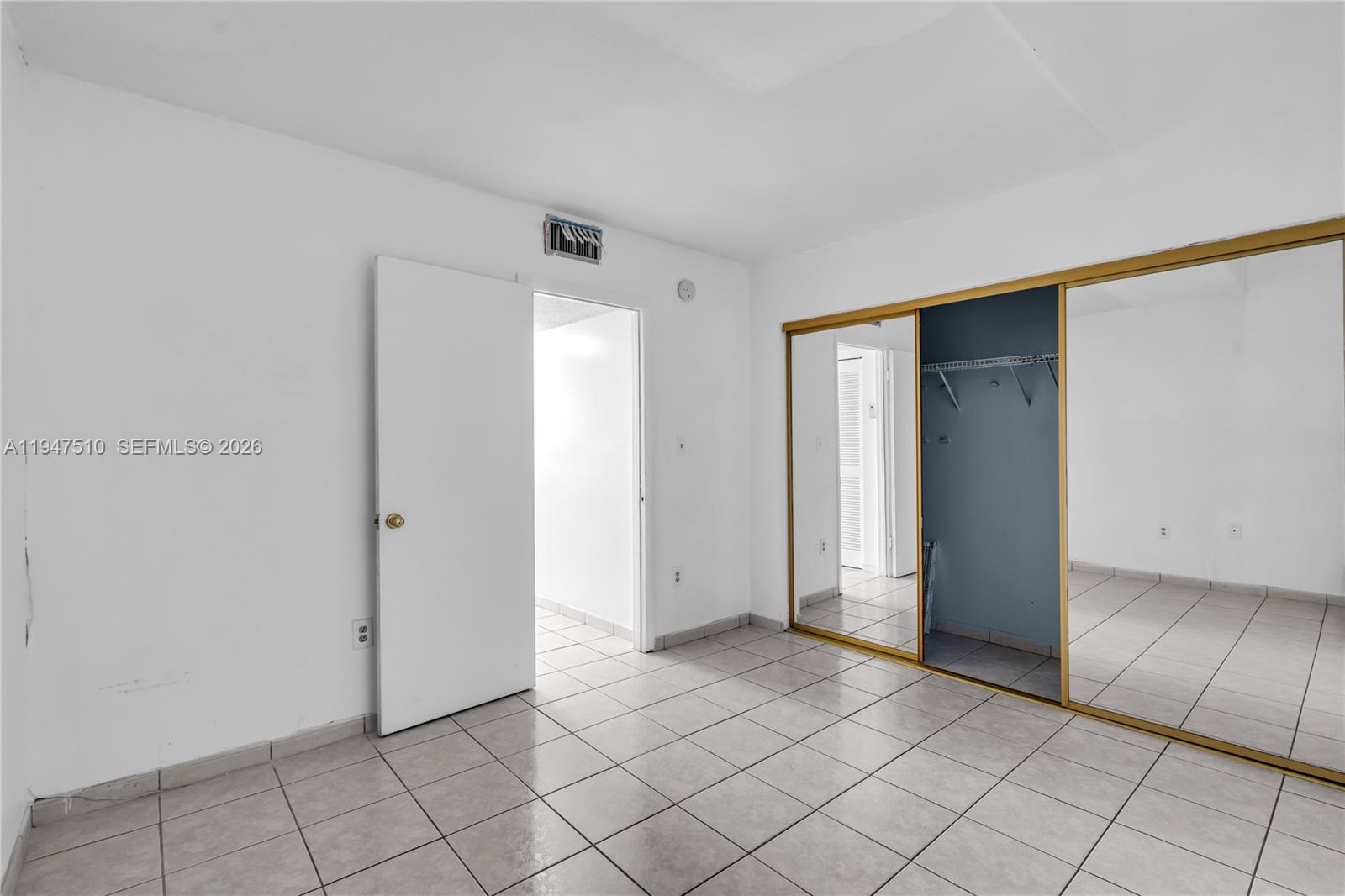 1750 West 56th Street, Unit 210 Hialeah, FL 33012 - Photo 14 of 22 a view of an empty room