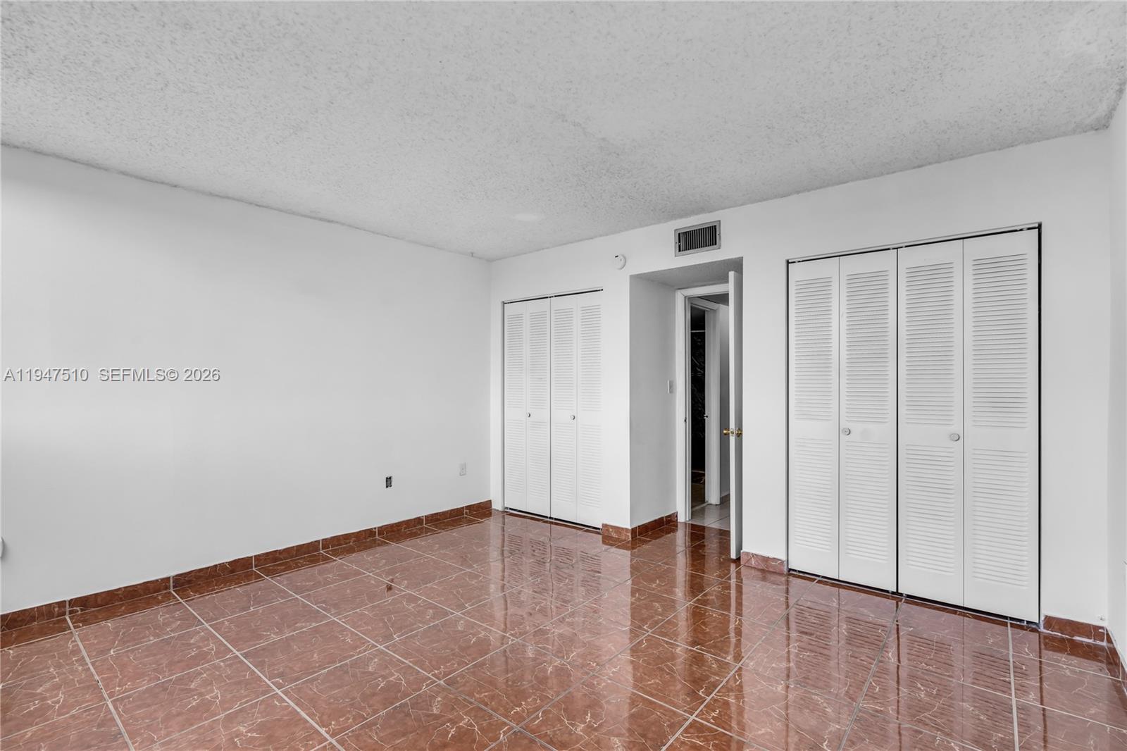 1750 West 56th Street, Unit 210 Hialeah, FL 33012 - Photo 17 of 22 a view of an empty room