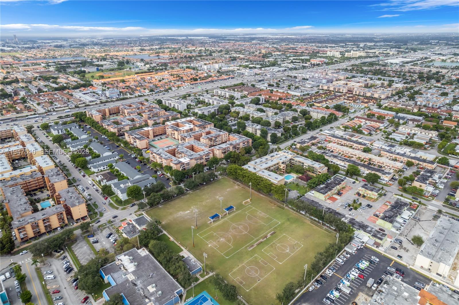 1750 West 56th Street, Unit 210 Hialeah, FL 33012 - Photo 20 of 22 an aerial view of residential houses with outdoor space