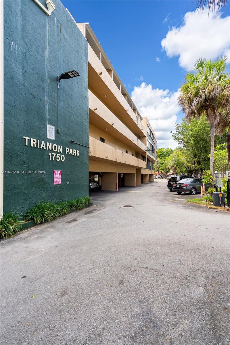 1750 West 56th Street, Unit 210 Hialeah, FL 33012 - Photo 2 of 22 a view of street with parked cars