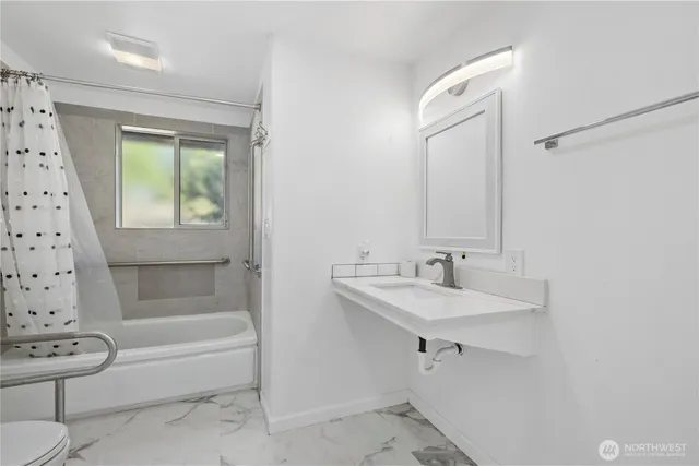 a bathroom with a sink and a mirror