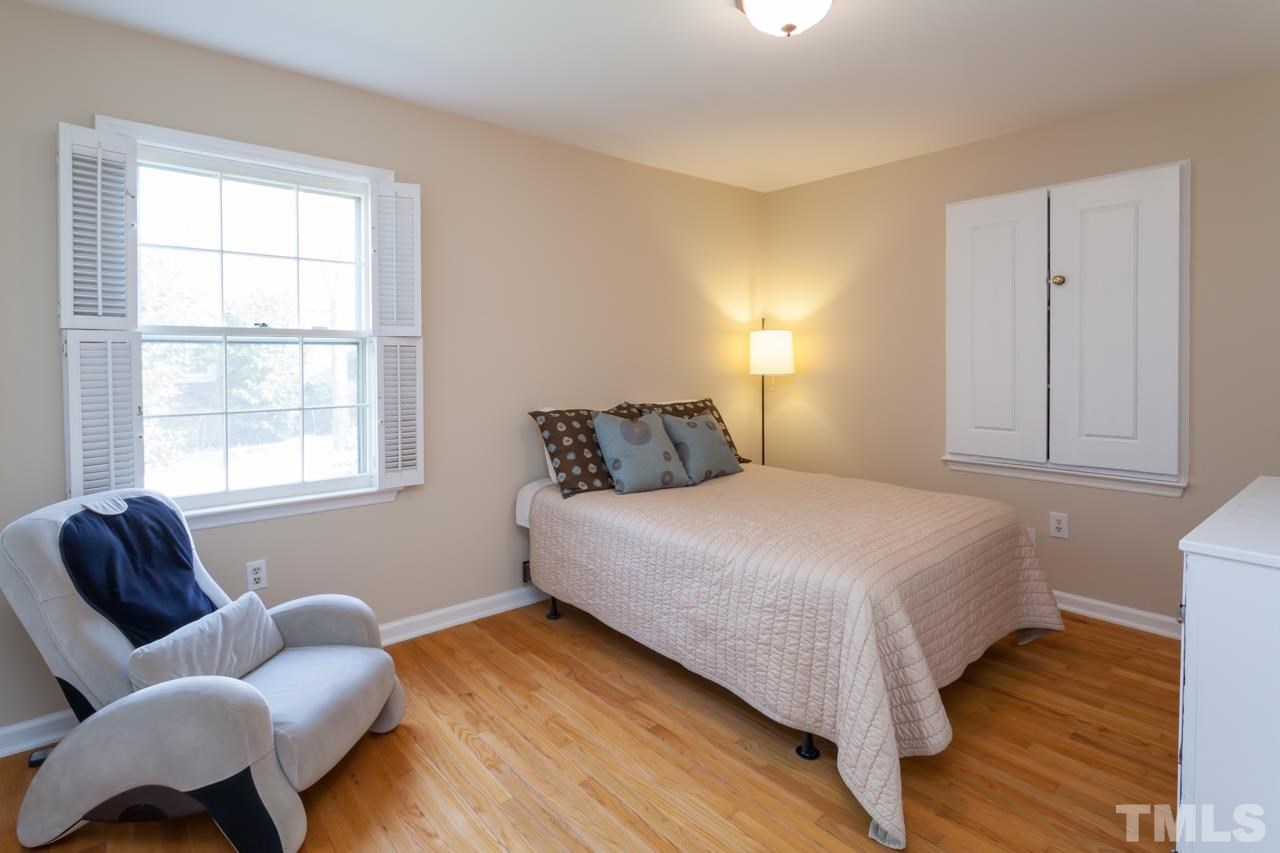 927 Winona Road Raleigh, NC 27609 - Photo 11 of 16 a bedroom with bed and window