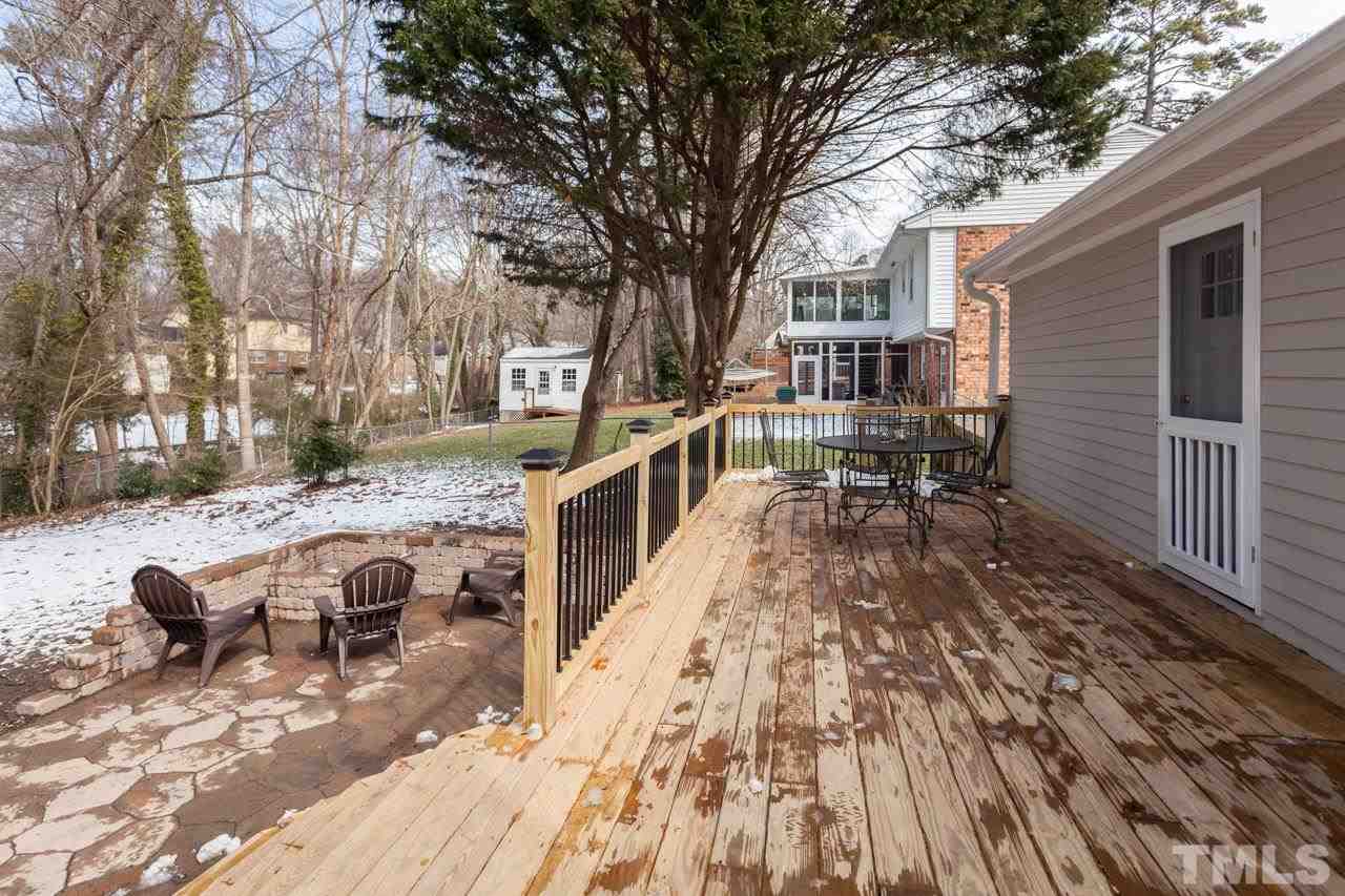927 Winona Road Raleigh, NC 27609 - Photo 16 of 16 a view of a house with backyard and sitting area