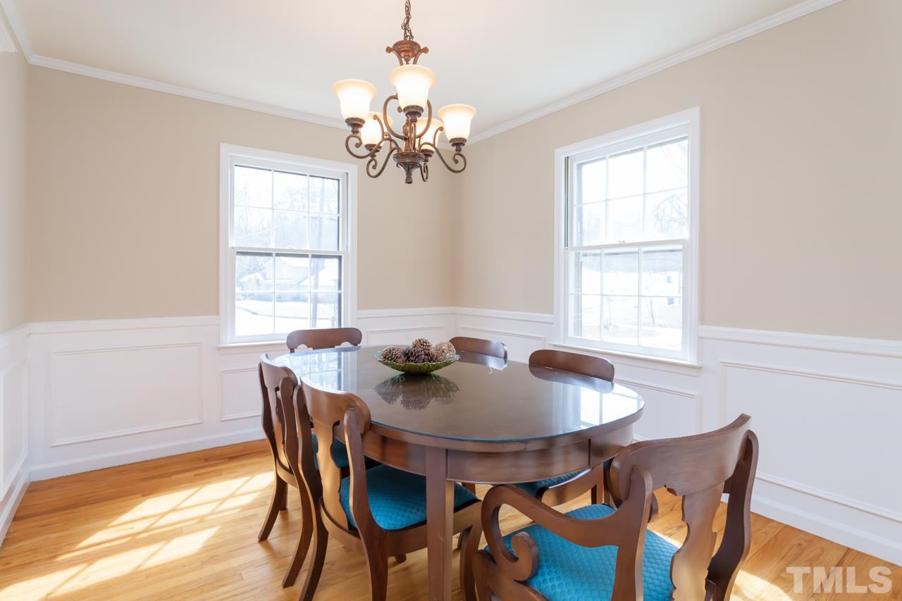 927 Winona Road Raleigh, NC 27609 - Photo 7 of 16 a view of a dining room with furniture window and outside view