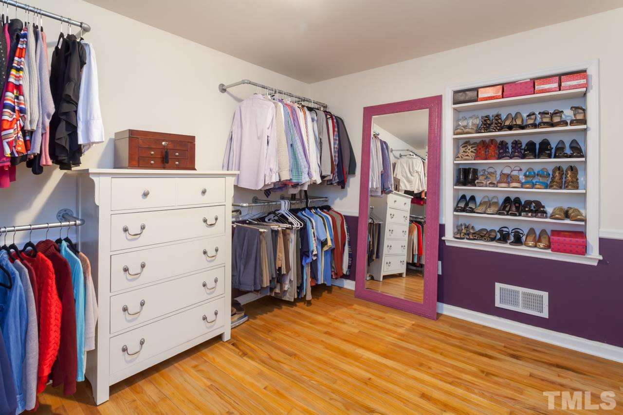 927 Winona Road Raleigh, NC 27609 - Photo 10 of 16 a view of walk in closet with clothes and shoes
