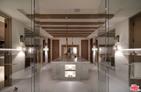 a large room with a large window and chandelier