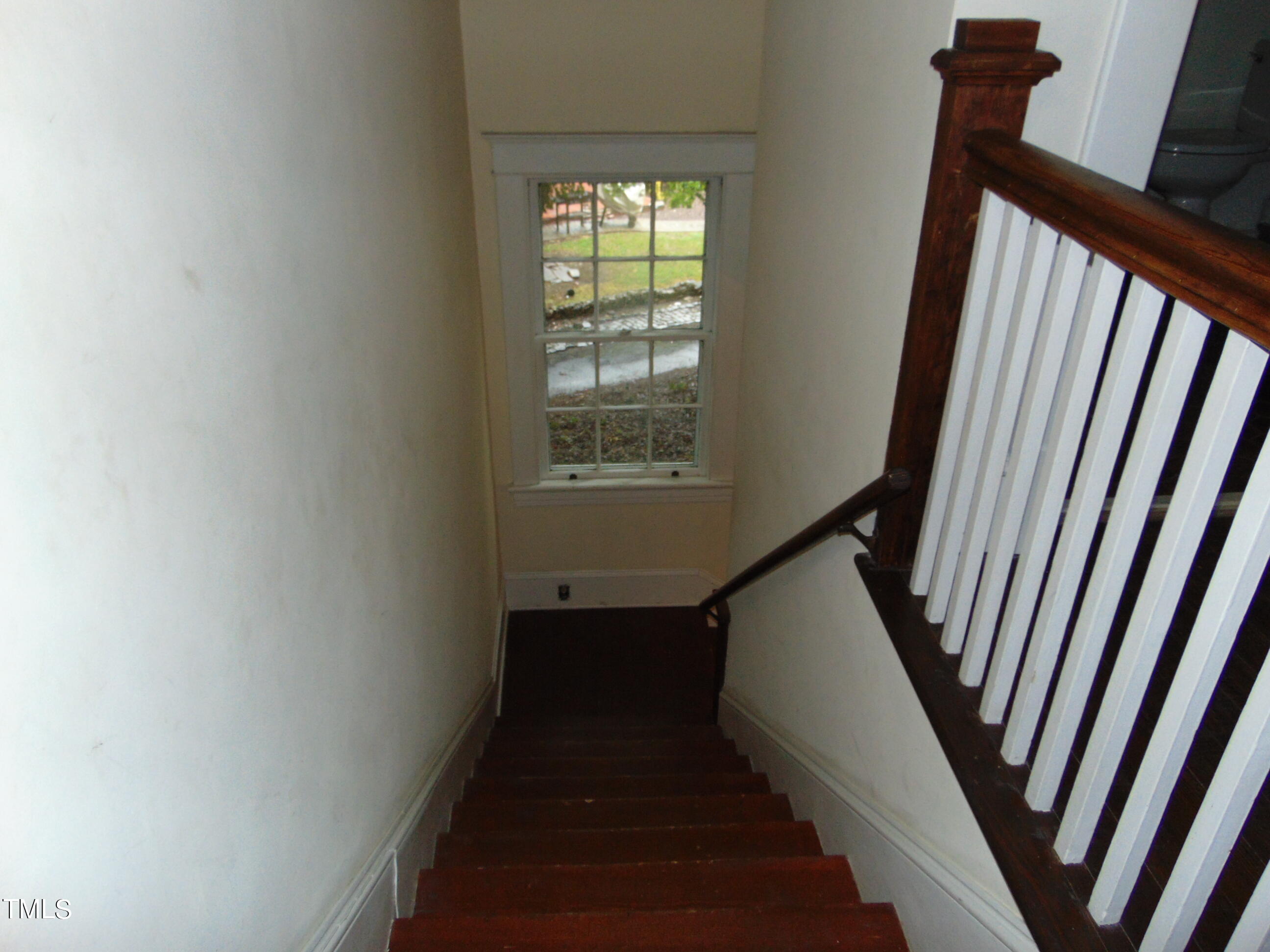 215 Woodburn Road Raleigh, NC 27605 - Photo 54 of 58 a view of stairs with wooden floor