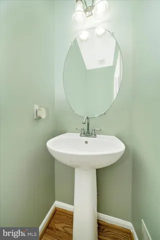 a bathroom with a sink a mirror and vanity