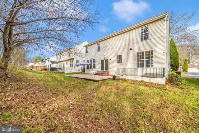 a view of a patio with a table and chairs