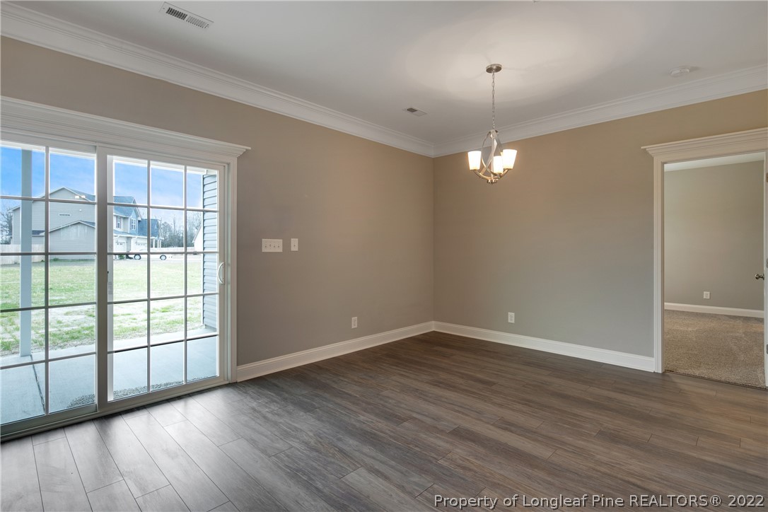 2643 Riddle Farm Hope Mills, NC 28348 - Photo 19 of 50 wooden floor in an empty room with a window