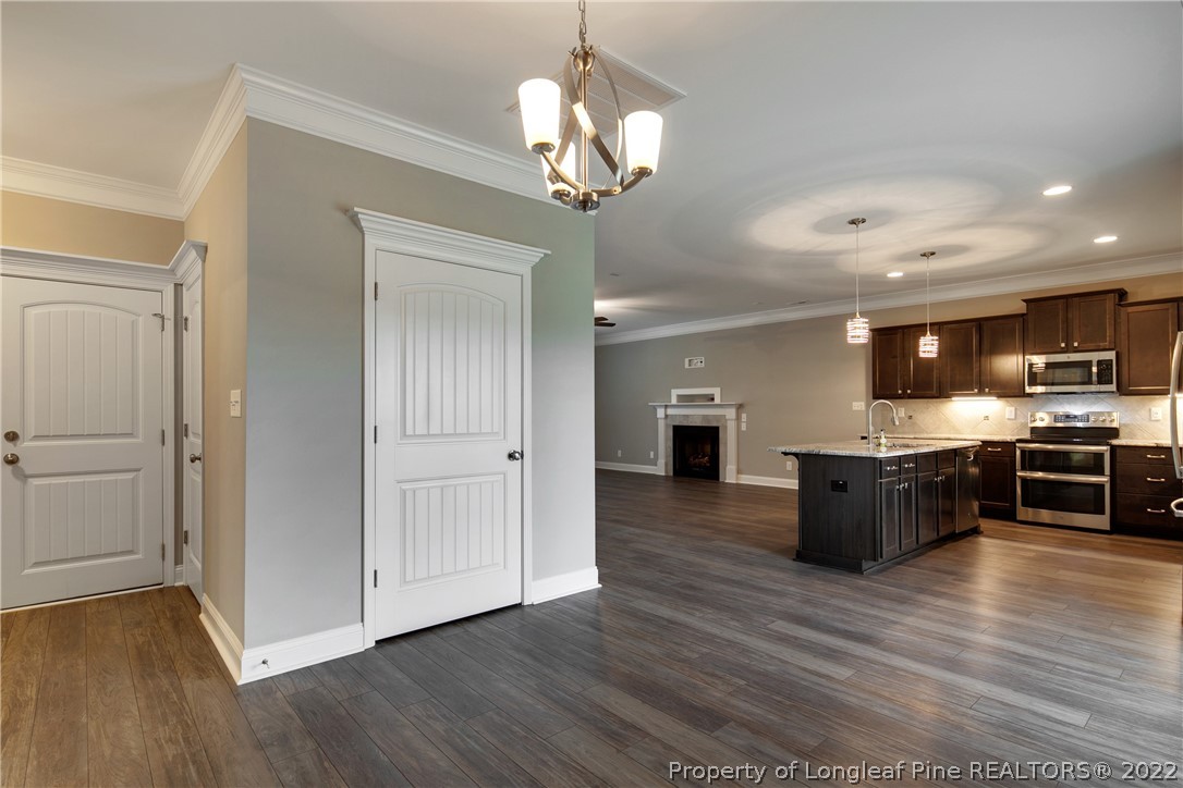 2643 Riddle Farm Hope Mills, NC 28348 - Photo 21 of 50 a large kitchen with a center island and stainless steel appliances