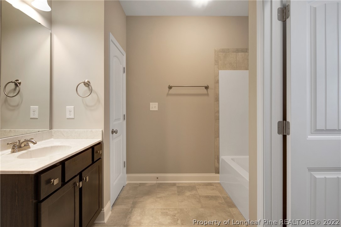 2643 Riddle Farm Hope Mills, NC 28348 - Photo 29 of 50 a bathroom with a sink and a mirror