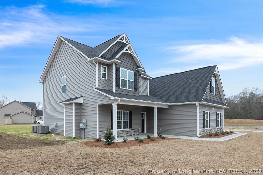 2643 Riddle Farm Hope Mills, NC 28348 - Photo 3 of 50 a front view of a house with a yard