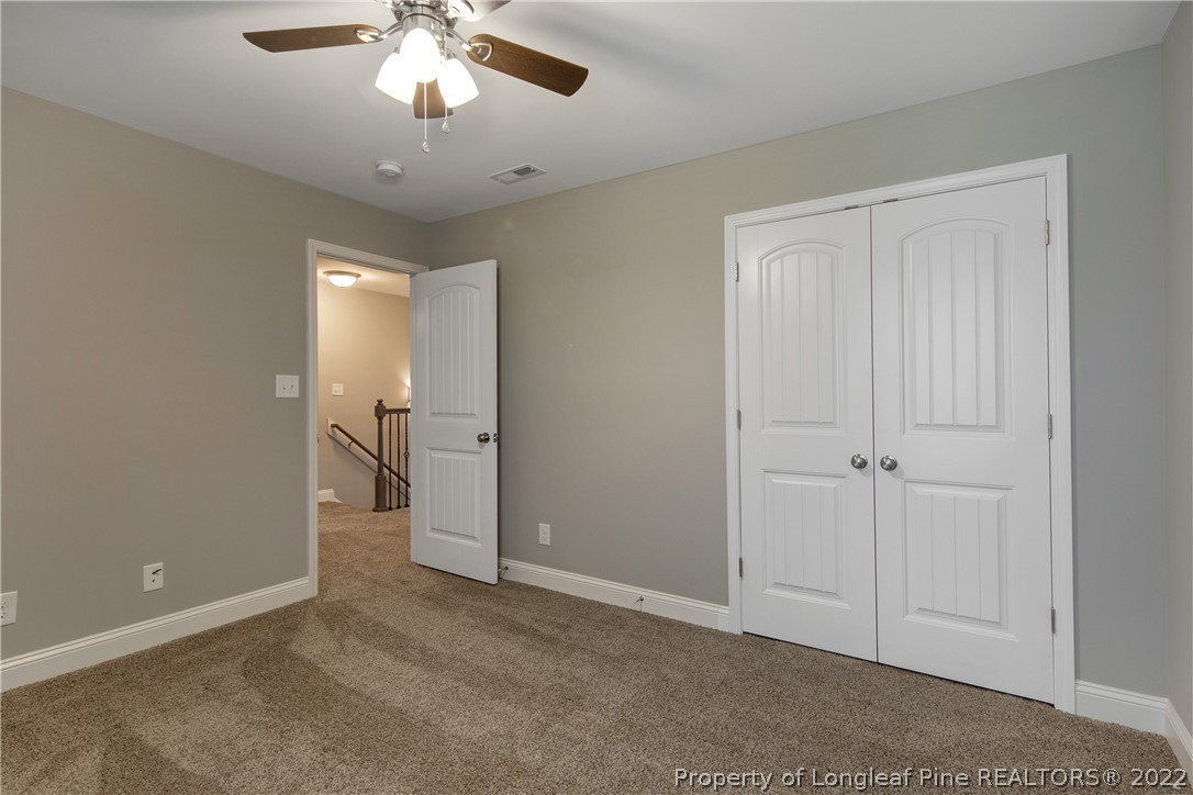 2643 Riddle Farm Hope Mills, NC 28348 - Photo 41 of 50 a view of a room with a ceiling fan and entryway