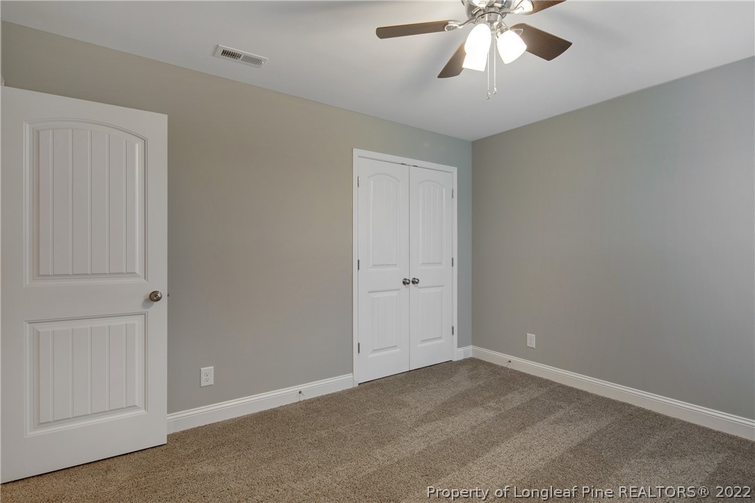 2643 Riddle Farm Hope Mills, NC 28348 - Photo 42 of 50 a view of an empty room and chandelier fan