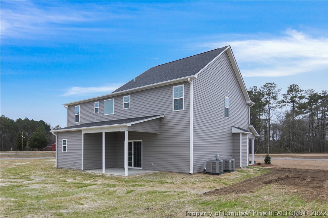 2643 Riddle Farm Hope Mills, NC 28348 - Photo 49 of 50 a view of a house with a yard