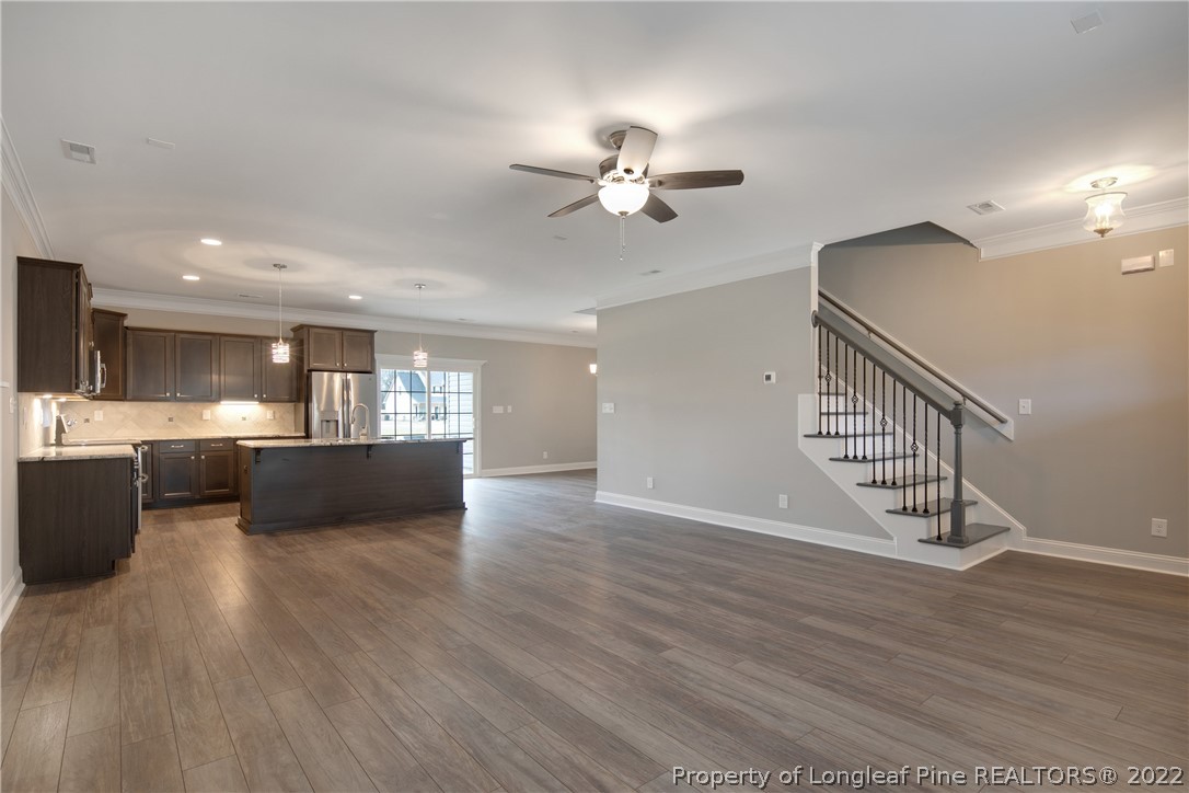 2643 Riddle Farm Hope Mills, NC 28348 - Photo 7 of 50 a view of a living room a ceiling fan and wooden floor