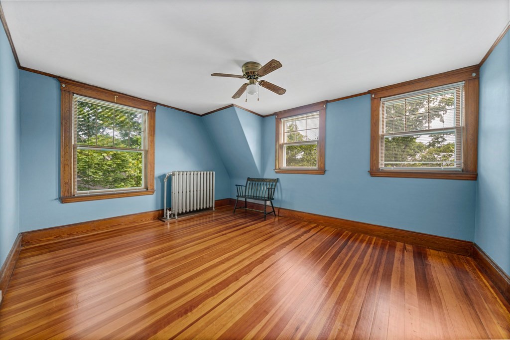 88 Independence Street Canton, MA 02021 - Photo 20 of 30 a view of empty room with wooden floor and fan