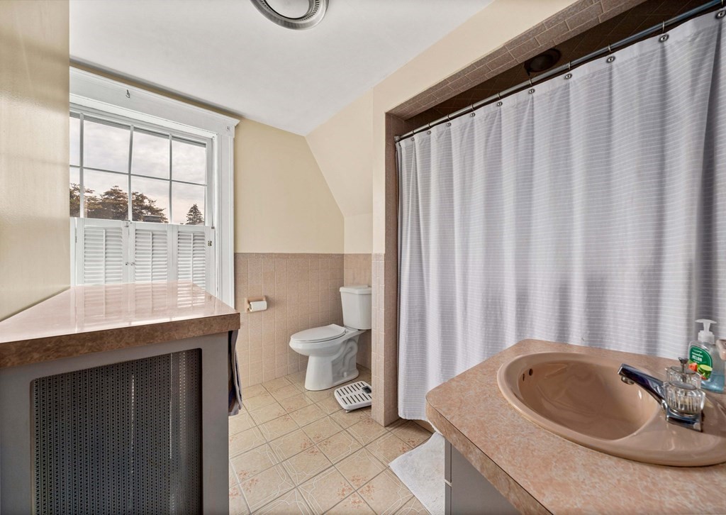 88 Independence Street Canton, MA 02021 - Photo 24 of 30 a bathroom with a sink toilet and shower