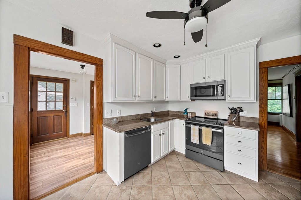 88 Independence Street Canton, MA 02021 - Photo 3 of 30 a kitchen with stainless steel appliances granite countertop a stove sink and cabinets