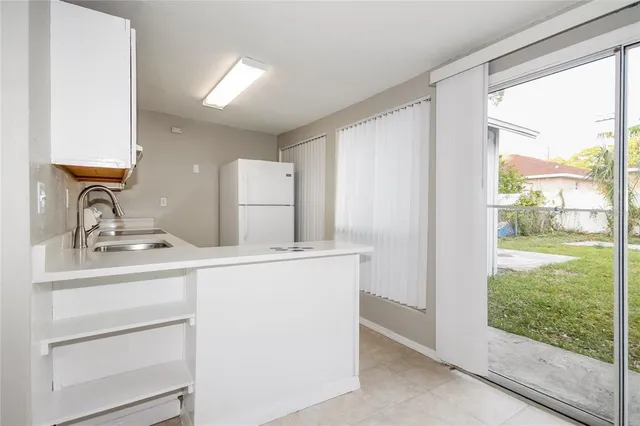 a view of a sink and a large mirror