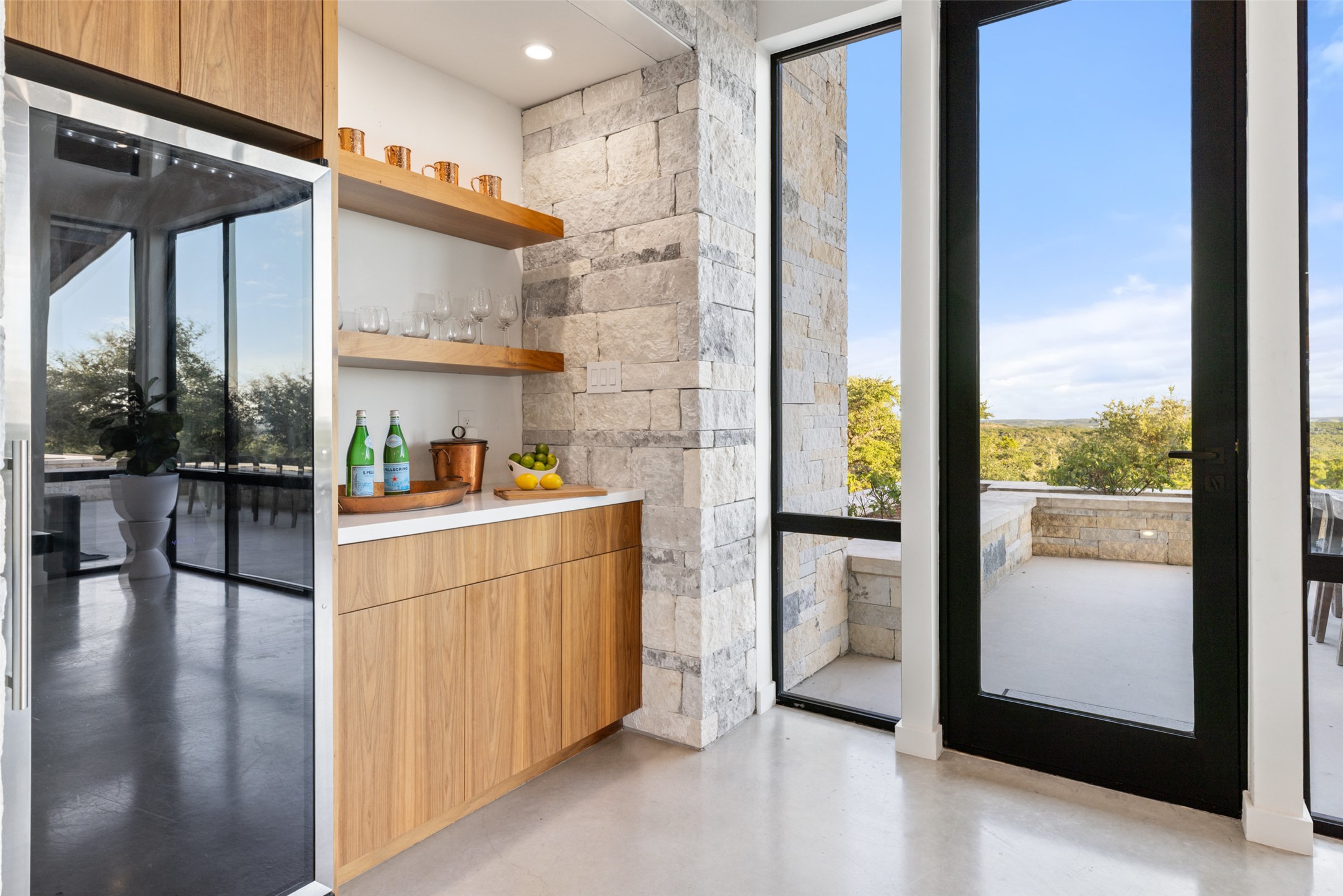 201 Gold Nugget Road Wimberley, TX 78676 - Photo 12 of 40 a view of washer and dryer with kitchen view
