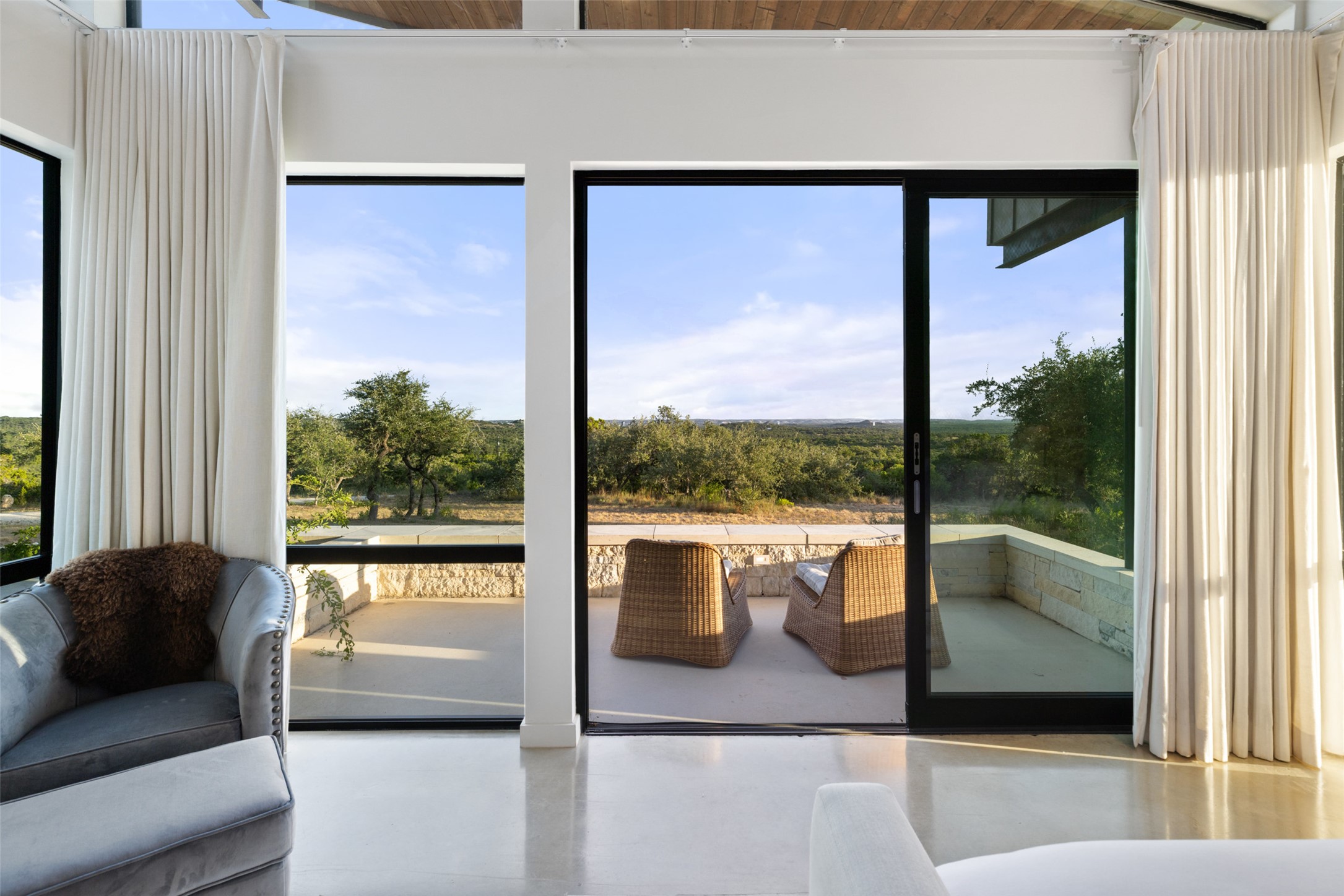 201 Gold Nugget Road Wimberley, TX 78676 - Photo 14 of 40 a living room with couch and a large window