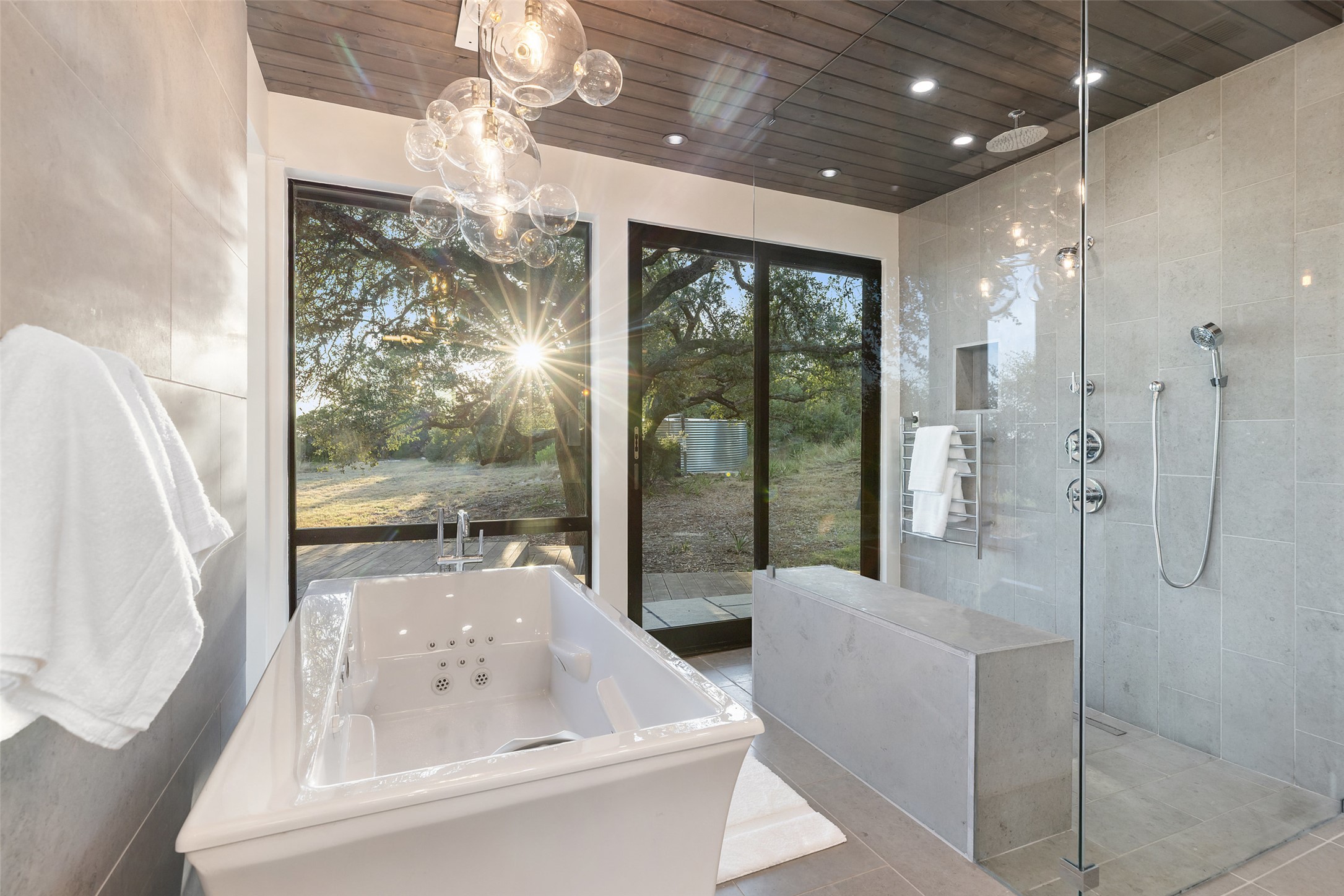 201 Gold Nugget Road Wimberley, TX 78676 - Photo 17 of 40 a bathroom with a tub shower and sink