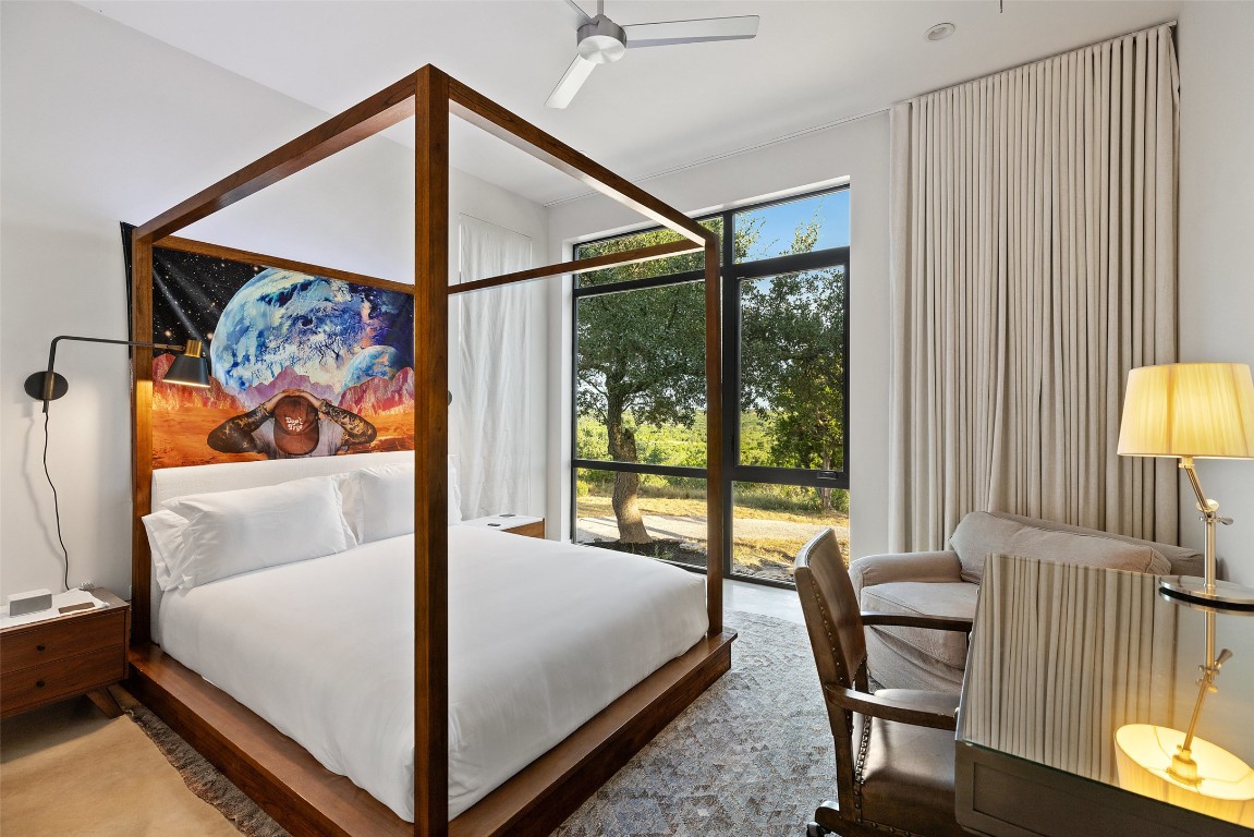 201 Gold Nugget Road Wimberley, TX 78676 - Photo 18 of 40 a bed sitting in a bedroom next to a window