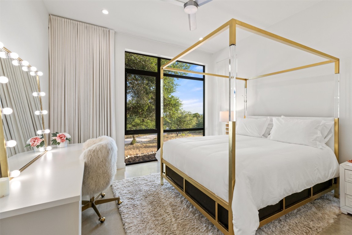 201 Gold Nugget Road Wimberley, TX 78676 - Photo 20 of 40 a bed room with a bed window and a chair