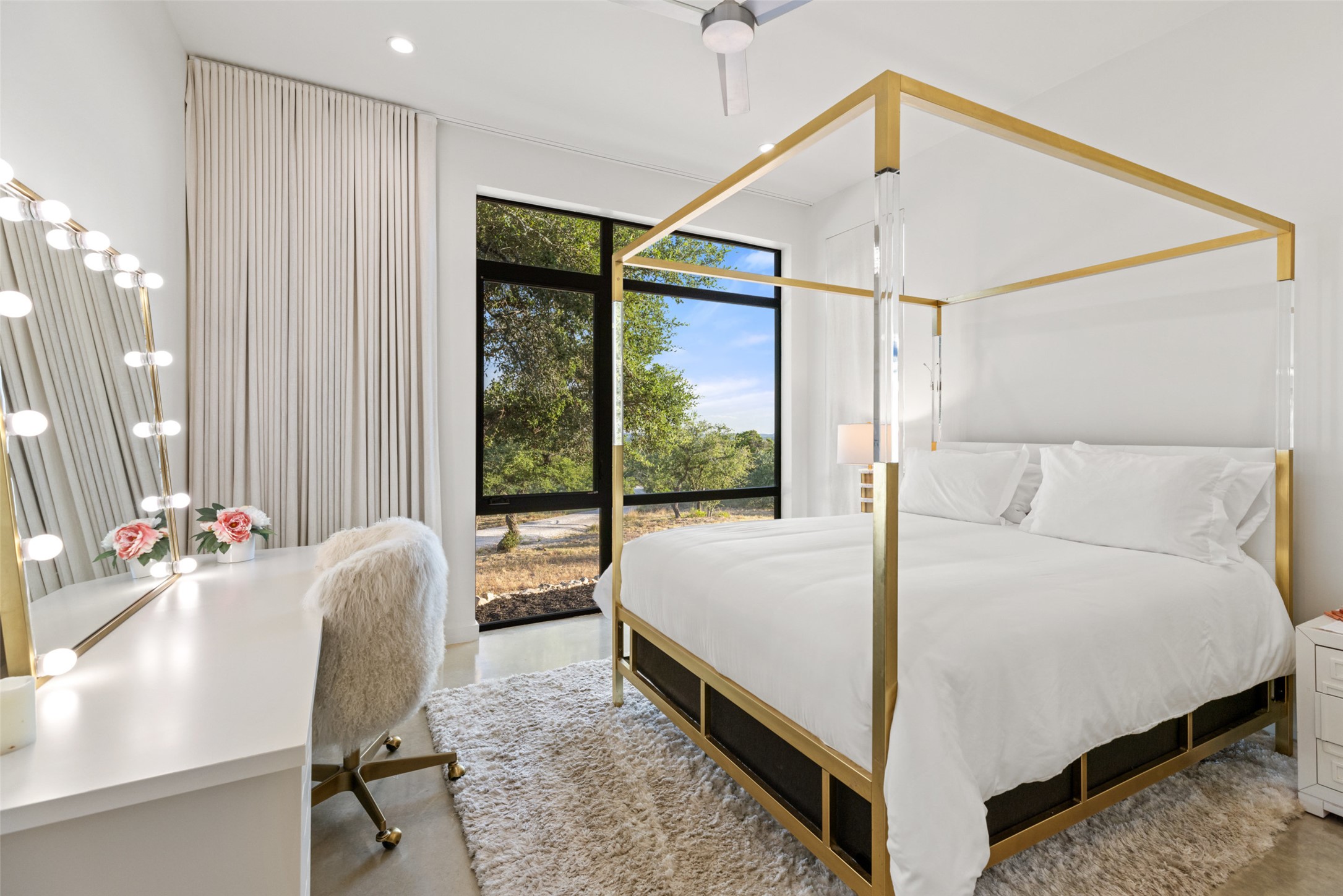 201 Gold Nugget Road Wimberley, TX 78676 - Photo 20 of 40 a bed room with a bed window and a chair