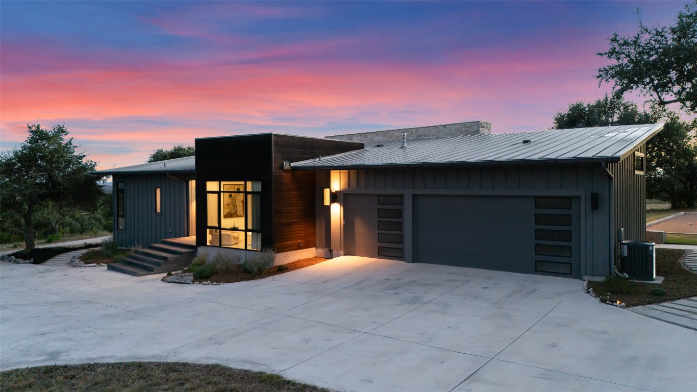 201 Gold Nugget Road Wimberley, TX 78676 - Photo 2 of 40 a front view of a house with a yard