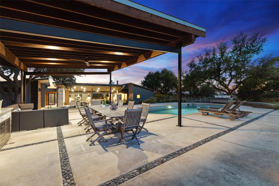 201 Gold Nugget Road Wimberley, TX 78676 - Photo 25 of 40 a view of a patio with a table and chairs