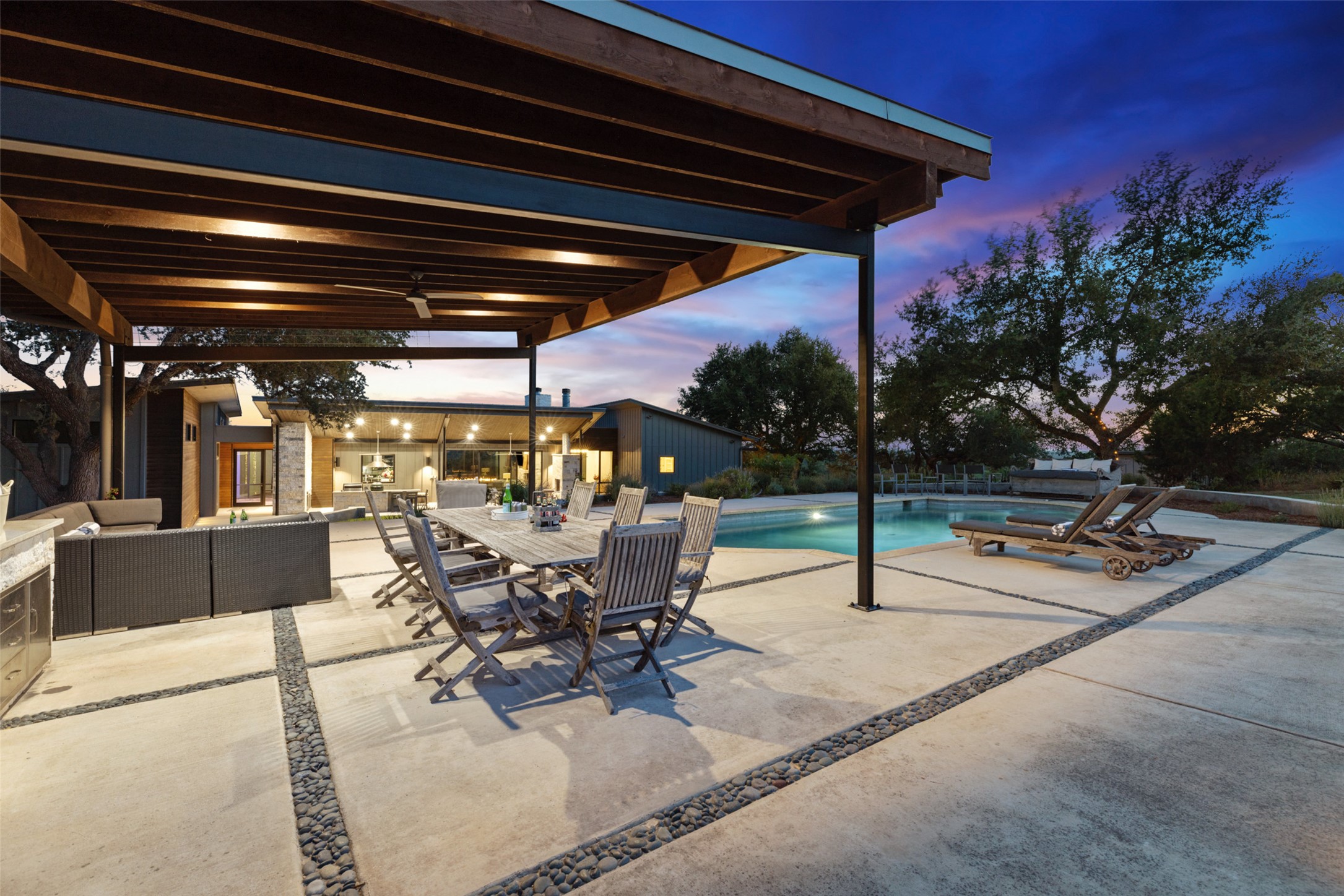 201 Gold Nugget Road Wimberley, TX 78676 - Photo 25 of 40 a view of a patio with a table and chairs
