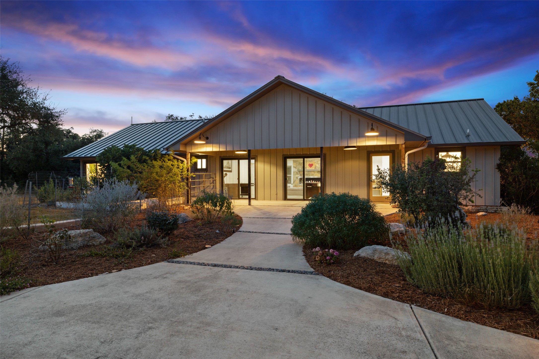 201 Gold Nugget Road Wimberley, TX 78676 - Photo 29 of 40 a front view of house with a garden