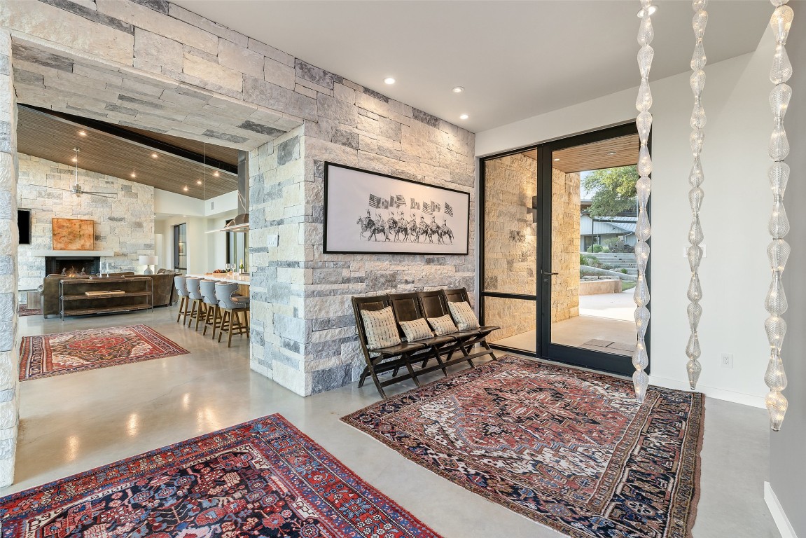 201 Gold Nugget Road Wimberley, TX 78676 - Photo 3 of 40 a living room with furniture and a rug