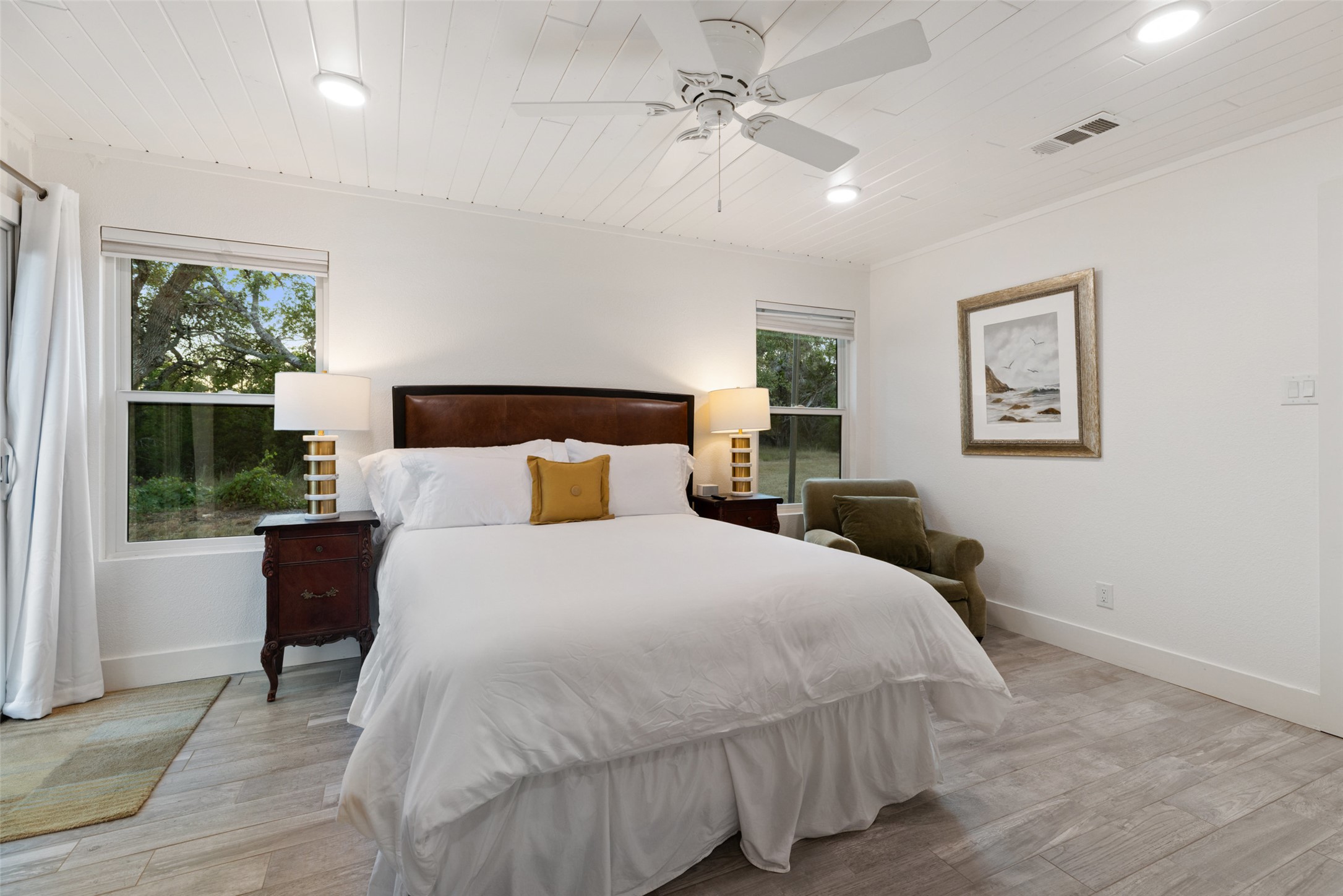 201 Gold Nugget Road Wimberley, TX 78676 - Photo 33 of 40 a bedroom with a large bed and a window