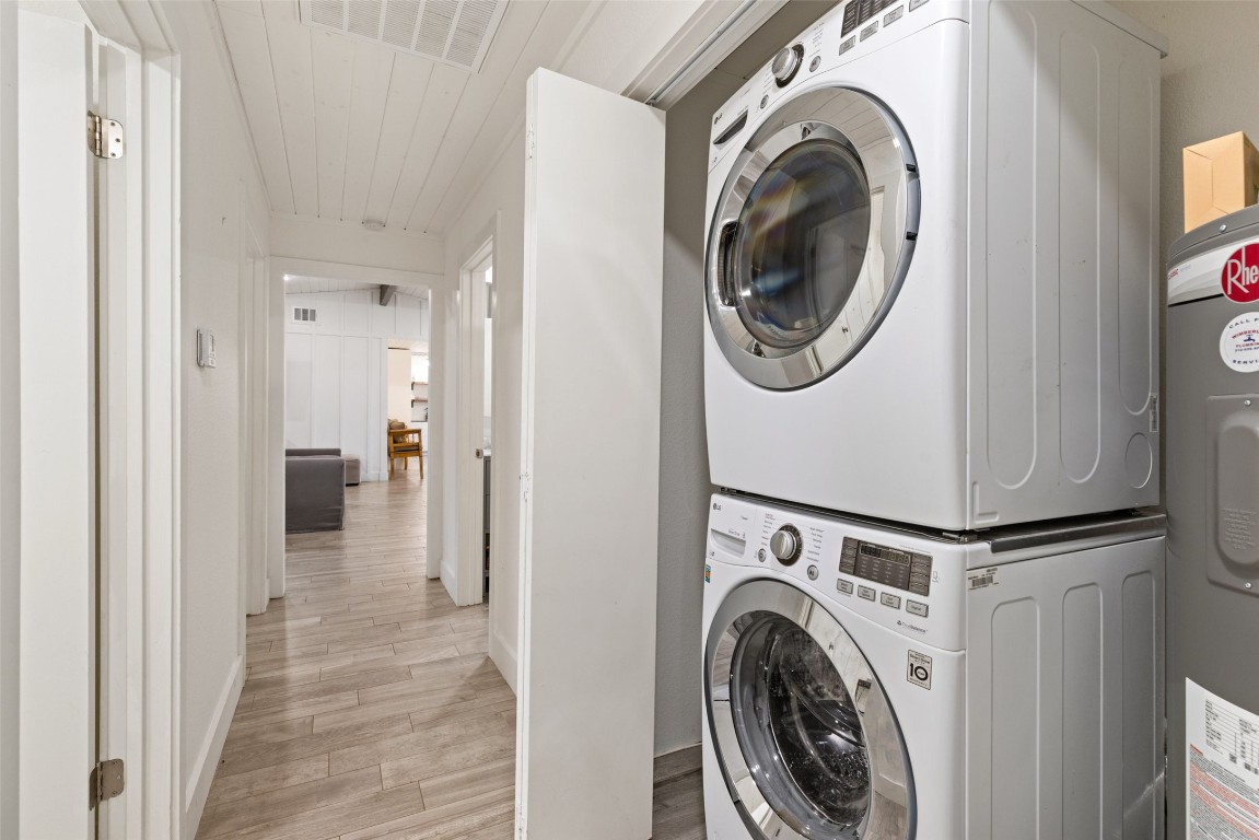 201 Gold Nugget Road Wimberley, TX 78676 - Photo 34 of 40 a view of a hallway with washer and dryer