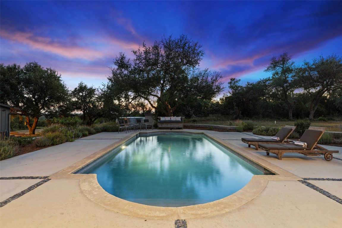 201 Gold Nugget Road Wimberley, TX 78676 - Photo 37 of 40 a view of a swimming pool with a yard