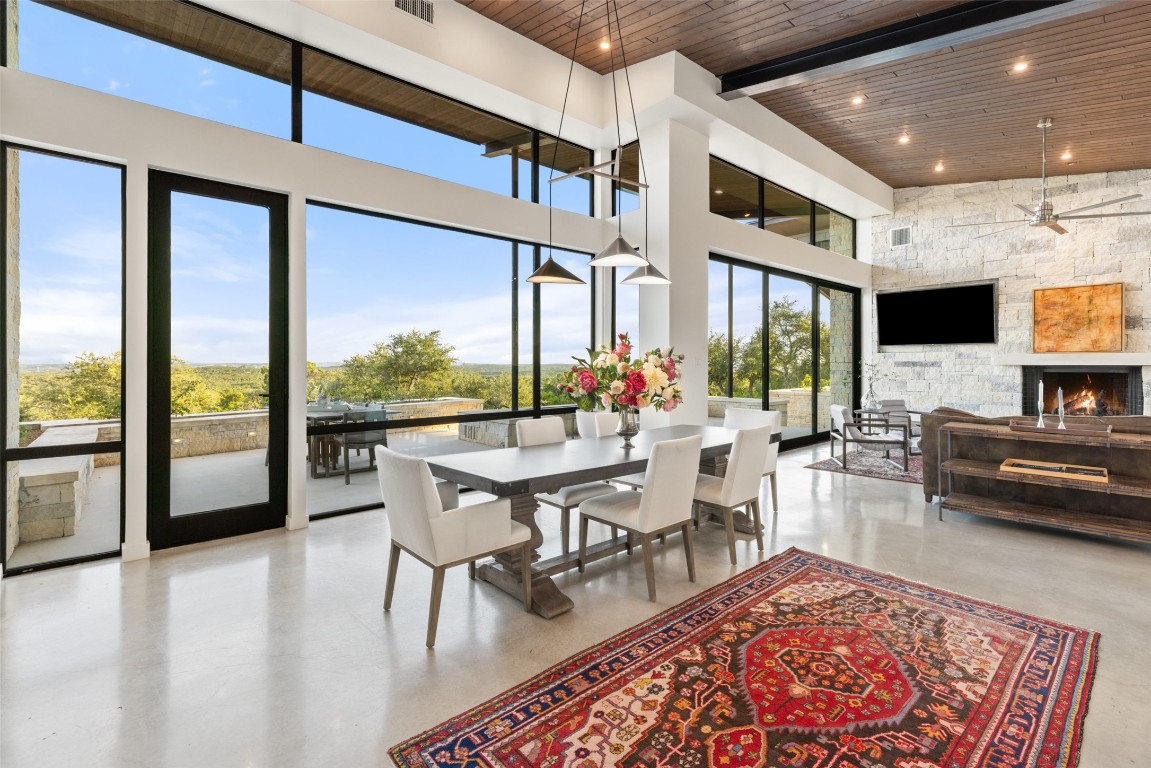 201 Gold Nugget Road Wimberley, TX 78676 - Photo 7 of 40 a living room with couches a coffee table and a flat screen tv