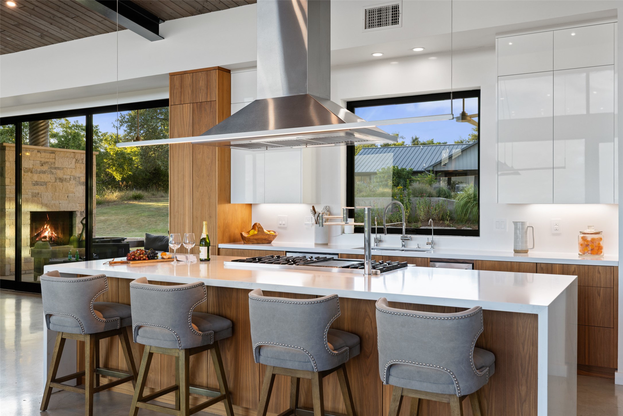 201 Gold Nugget Road Wimberley, TX 78676 - Photo 8 of 40 a kitchen with stainless steel appliances a sink and a large window