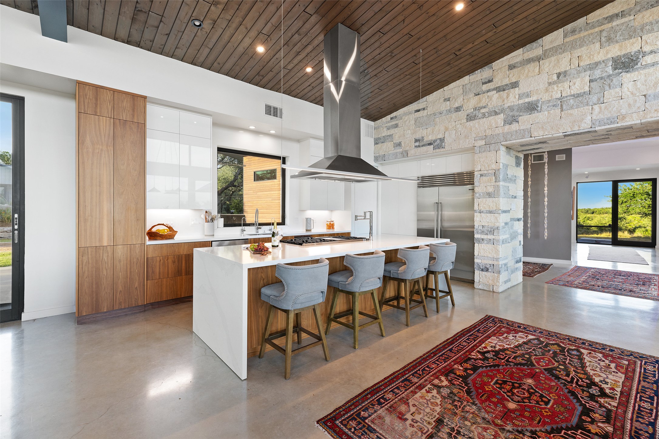 201 Gold Nugget Road Wimberley, TX 78676 - Photo 9 of 40 a living room with dining room and wooden floor