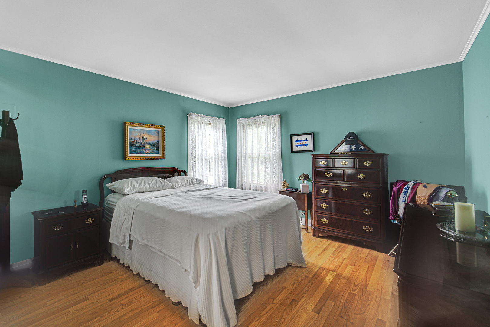 1740 Good Avenue Park Ridge, IL 60068 - Photo 11 of 22 a bedroom with a bed and wooden floor