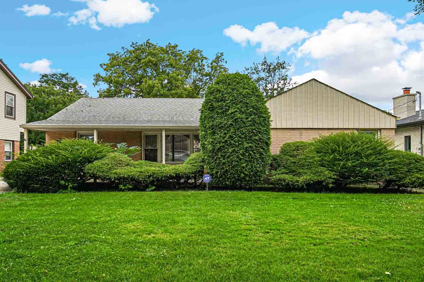 1740 Good Avenue Park Ridge, IL 60068 - Photo 21 of 22 a view of a house with a yard and a garden