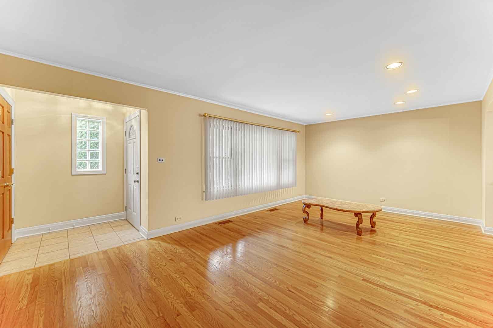 1740 Good Avenue Park Ridge, IL 60068 - Photo 3 of 22 a view of an empty room with wooden floor and a window