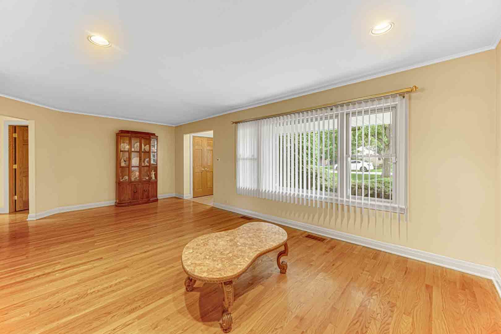 1740 Good Avenue Park Ridge, IL 60068 - Photo 4 of 22 a view of an empty room with wooden floor and a window