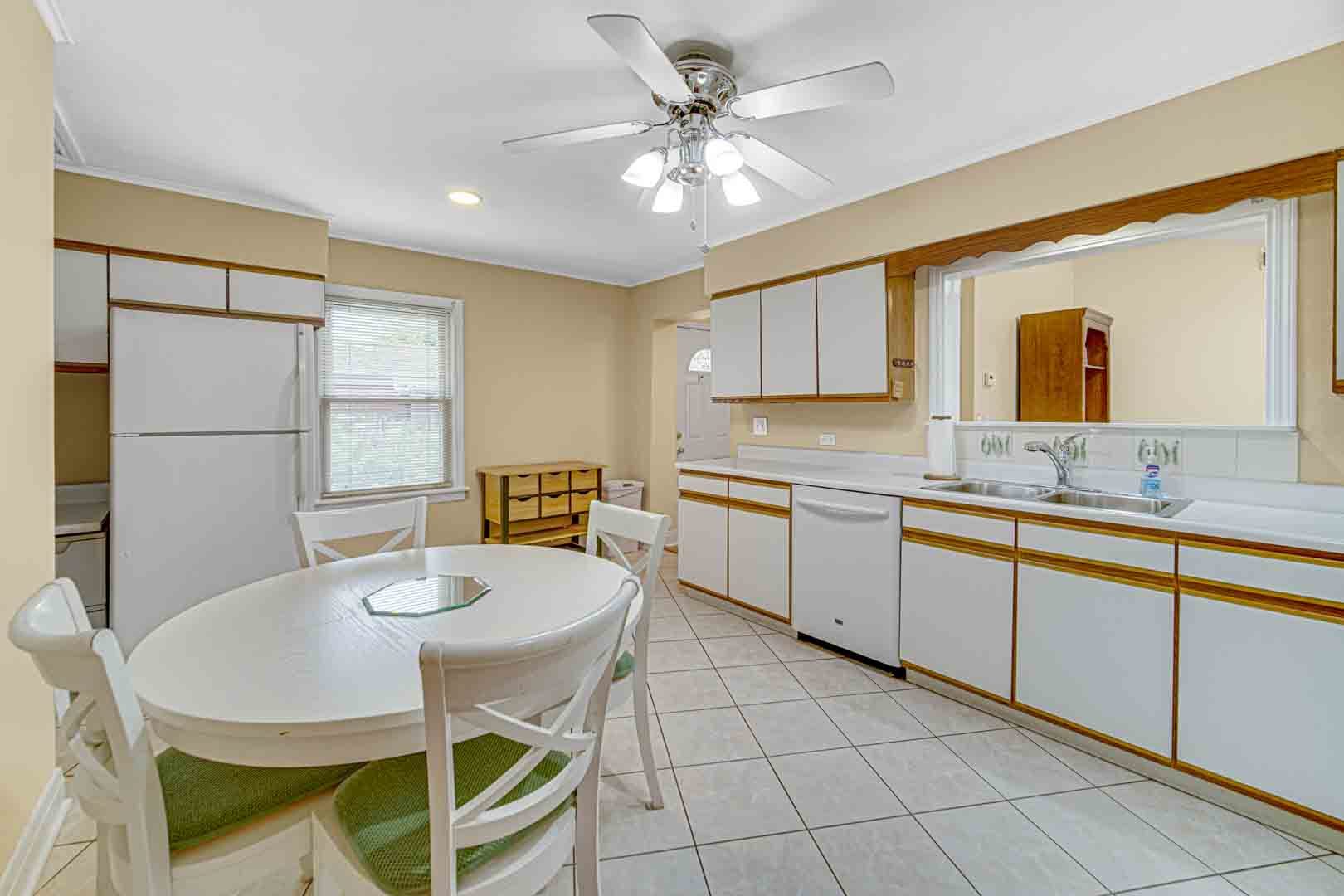 1740 Good Avenue Park Ridge, IL 60068 - Photo 6 of 22 a kitchen with a dining table chairs and white cabinets