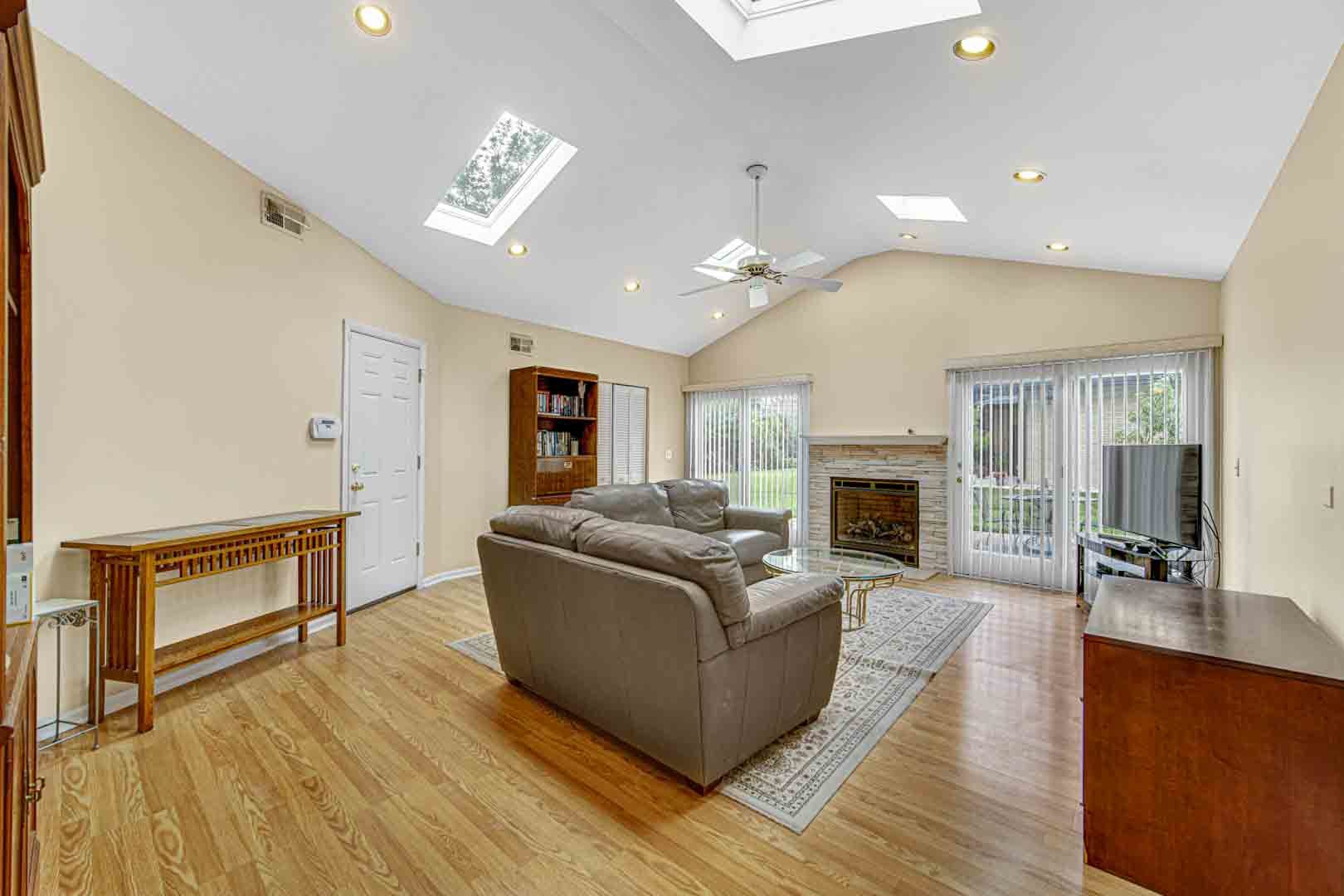 1740 Good Avenue Park Ridge, IL 60068 - Photo 9 of 22 a living room with furniture a fireplace and a flat screen tv