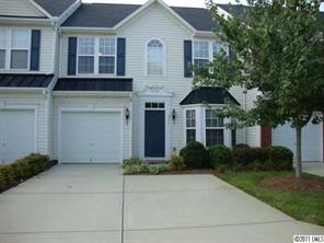 613 Colbert Way Fort Mill, SC 29715 - Photo 1 of 16 a front view of a house with garden
