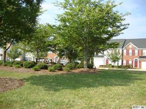 613 Colbert Way Fort Mill, SC 29715 - Photo 15 of 16 a view of a house with a big yard and large trees